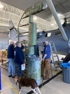 Looking surprisingly large when on the ground, the rudder of the Military Aviation Museum’s N9521C during refurbishment earlier this year at Virginia Beach. The dog is clearly not impressed with the Cat’ via Military Air Museum